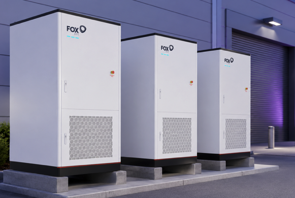 Three Fox commercial battery storage units installed outside a business premises